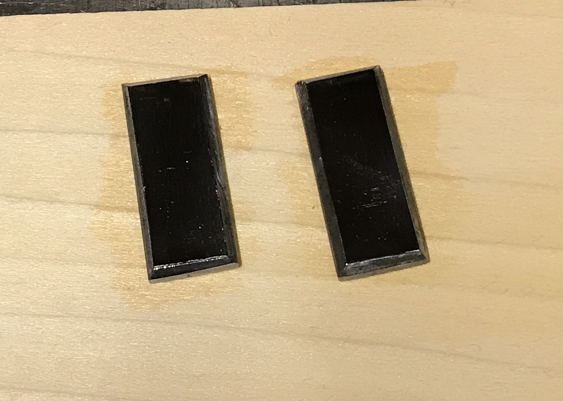 Two rectangular covers to hide the holes